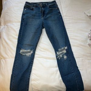 Blue, American eagle mom jeans. Ripped knees. Size 2. Never worn